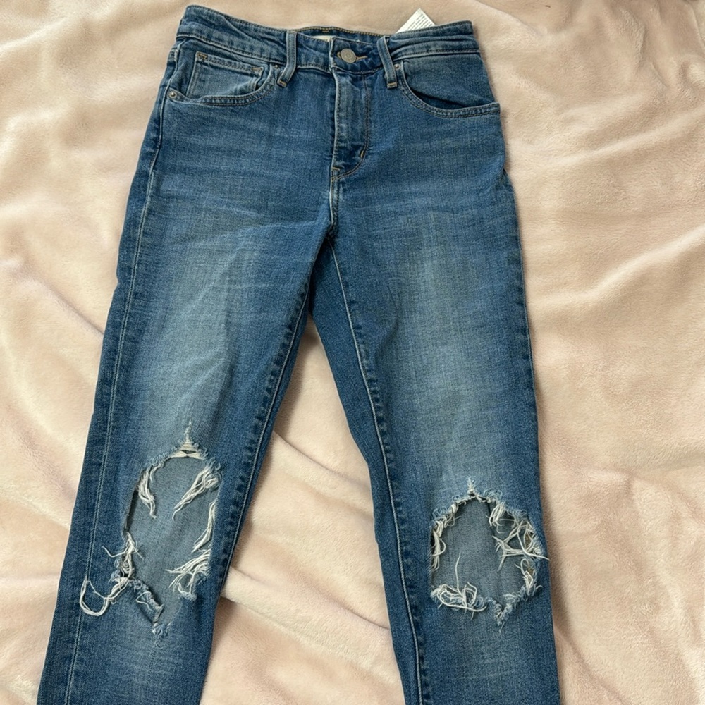 721 high rise skinny Levi distressed jeans